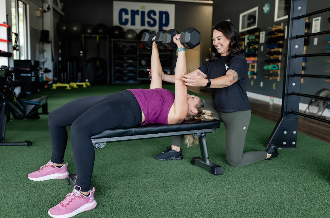 Dr. Brianna Stagg performing comprehensive knee assessment with patient in modern Scarborough physical therapy facility