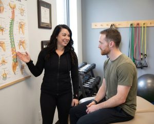 Patient working with a provider at a performance physical therapy clinic in Scarborough