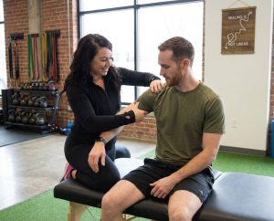 Patient working with a provider at a performance physical therapy clinic in Scarborough